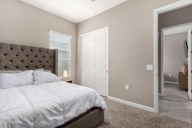 carpeted bedroom featuring a closet