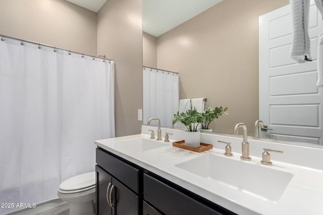 bathroom featuring vanity, toilet, and a shower with shower curtain