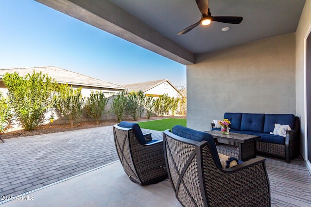 view of patio with outdoor lounge area and ceiling fan