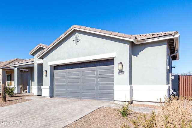 ranch-style home featuring a garage