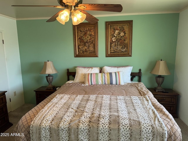 bedroom featuring a ceiling fan, dark colored carpet, and crown molding