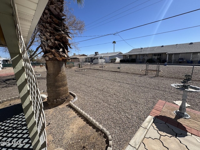 view of yard with a residential view and fence
