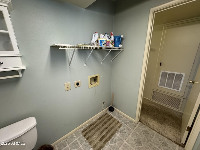 laundry area with baseboards, hookup for a washing machine, visible vents, and hookup for an electric dryer