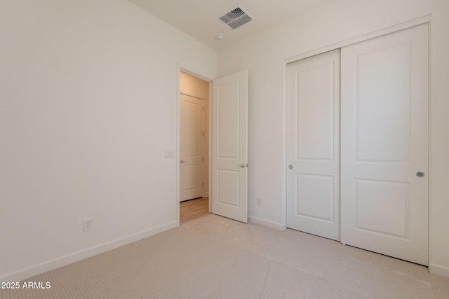 17966 W Long Lake Rd, Goodyear, AZ 85338 - unfurnished bedroom with light colored carpet and a closet