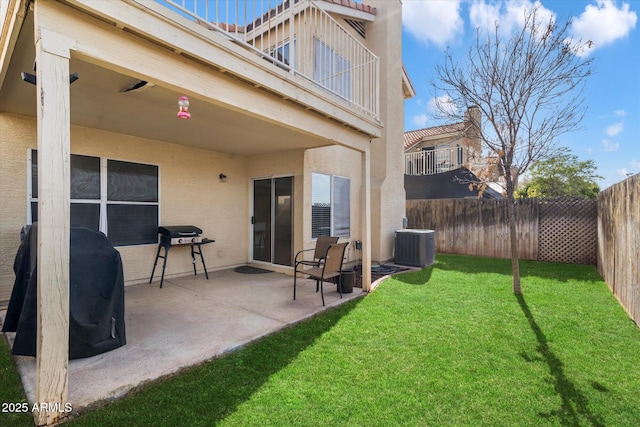 exterior space with a yard, central AC unit, and a patio area