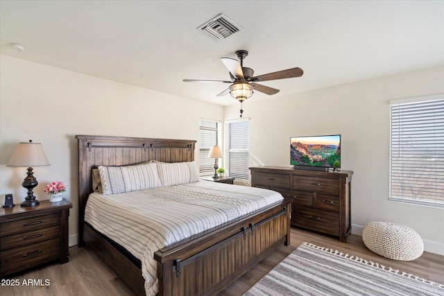 bedroom featuring hardwood / wood-style floors and ceiling fan