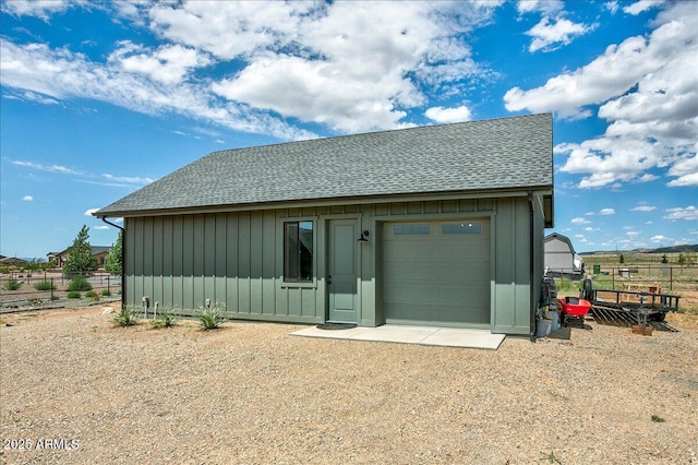 exterior space with an outdoor structure and a garage