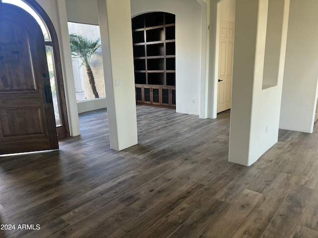 foyer with dark hardwood / wood-style floors