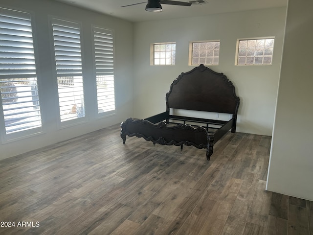 sitting room featuring ceiling fan and dark wood-type flooring