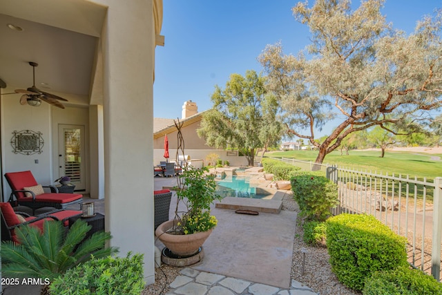 9905 N 78th Pl, Scottsdale, AZ 85258 - view of patio / terrace with a fenced in pool, fence private yard, a ceiling fan, and view of golf course