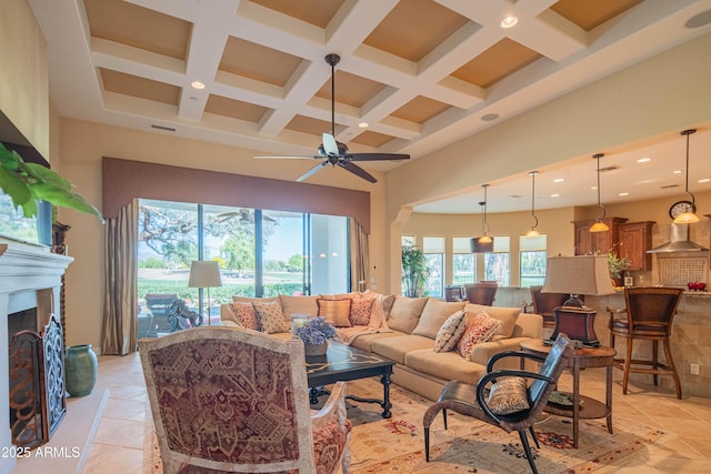 9905 N 78th Pl, Scottsdale, AZ 85258 - living area with beamed ceiling, a high ceiling, a ceiling fan, and coffered ceiling
