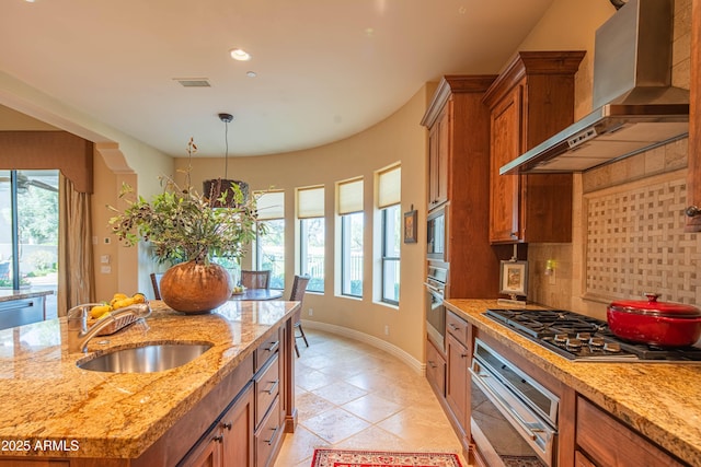 9905 N 78th Pl, Scottsdale, AZ 85258 - kitchen featuring wall chimney exhaust hood, visible vents, appliances with stainless steel finishes, a sink, and brown cabinets