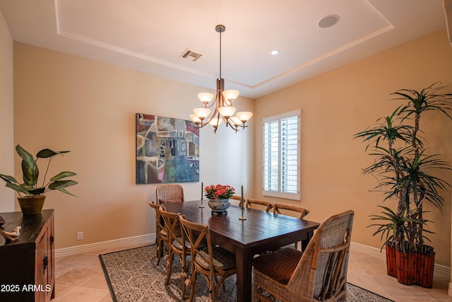 9905 N 78th Pl, Scottsdale, AZ 85258 - dining space featuring a chandelier, light tile patterned floors, a tray ceiling, and baseboards