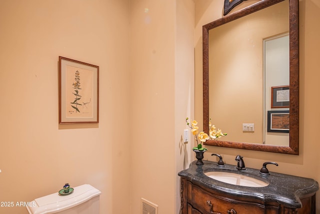 9905 N 78th Pl, Scottsdale, AZ 85258 - half bath with visible vents, toilet, and vanity
