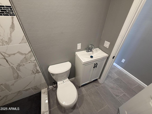 5042 S 22nd St, Phoenix, AZ 85040 - full bathroom featuring toilet, vanity, and a tile shower