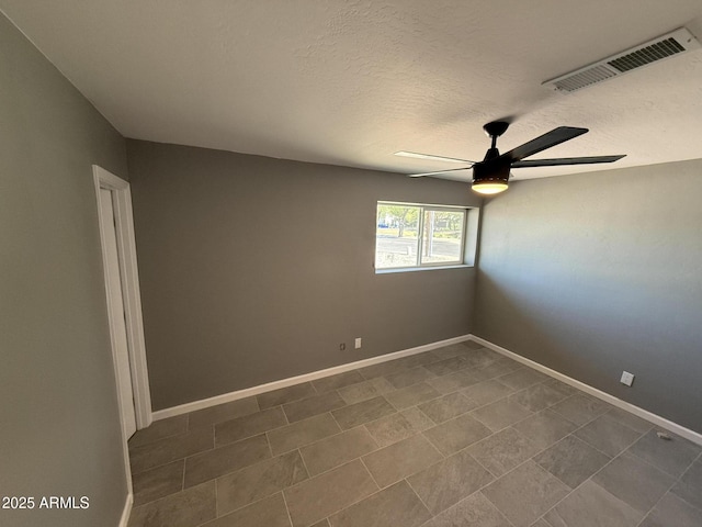 5042 S 22nd St, Phoenix, AZ 85040 - unfurnished room with a ceiling fan, baseboards, and a textured ceiling