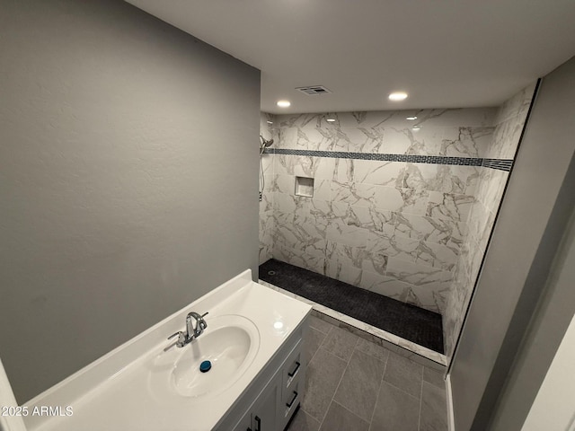 5042 S 22nd St, Phoenix, AZ 85040 - full bath with a marble finish shower, recessed lighting, and vanity