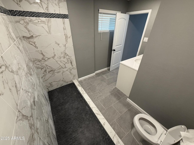 5042 S 22nd St, Phoenix, AZ 85040 - bathroom featuring toilet, vanity, and a tile shower