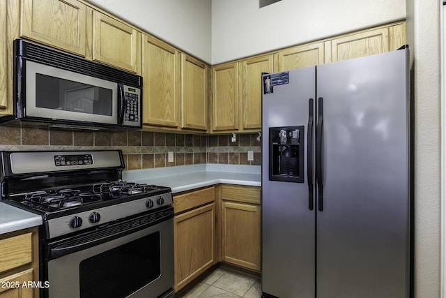 1623 E Krystal St, Casa Grande, AZ 85122 - kitchen with light countertops, stainless steel appliances, decorative backsplash, and light tile patterned flooring