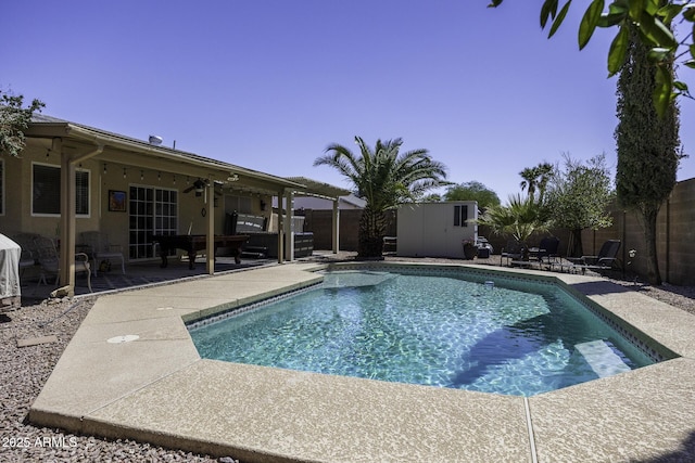1623 E Krystal St, Casa Grande, AZ 85122 - view of swimming pool featuring a patio, a fenced in pool, a fenced backyard, and a shed