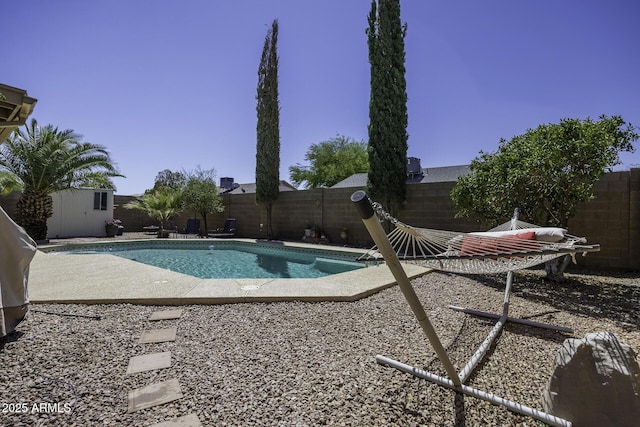 1623 E Krystal St, Casa Grande, AZ 85122 - view of swimming pool featuring a fenced backyard, a fenced in pool, a patio, and an outbuilding