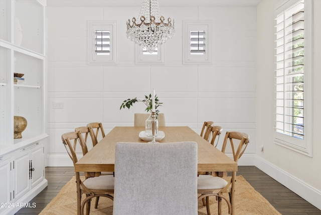 dining area with an inviting chandelier and dark hardwood / wood-style floors