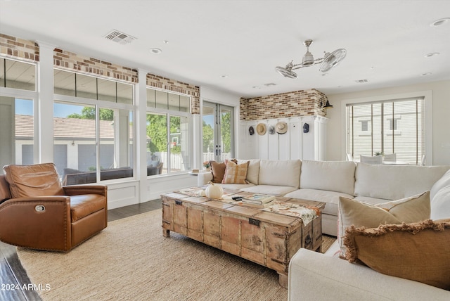 living room featuring light hardwood / wood-style floors and a wealth of natural light