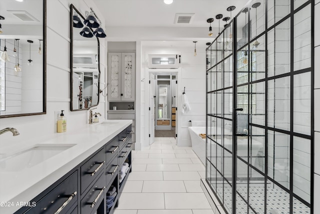 bathroom featuring vanity, tile patterned floors, and plus walk in shower