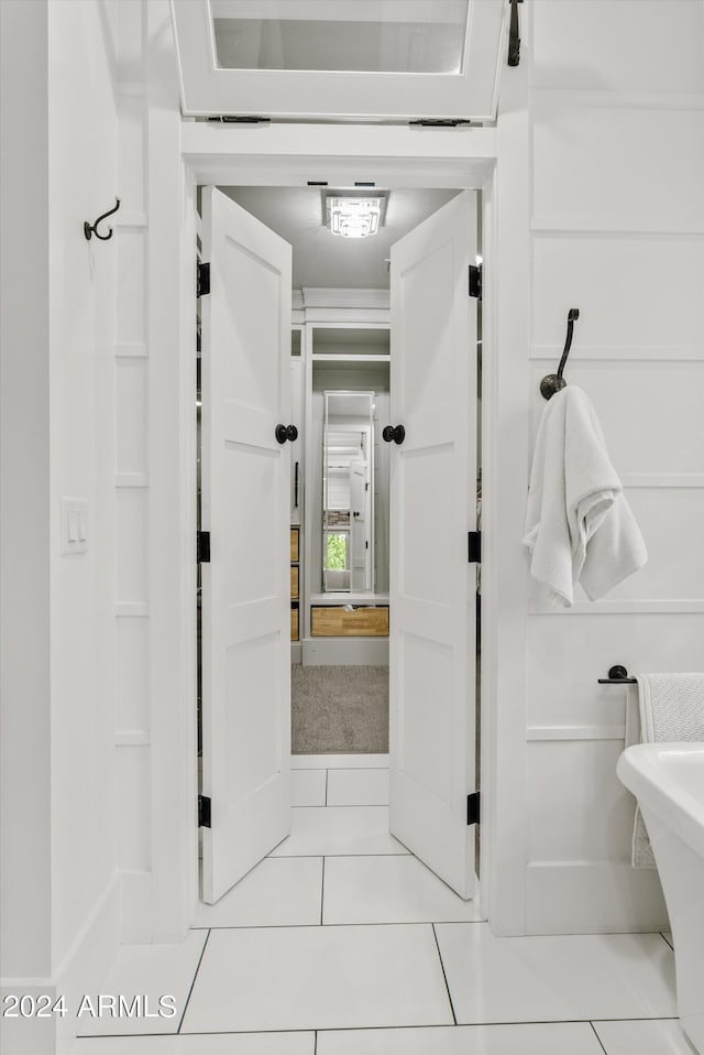 hall featuring tile patterned floors