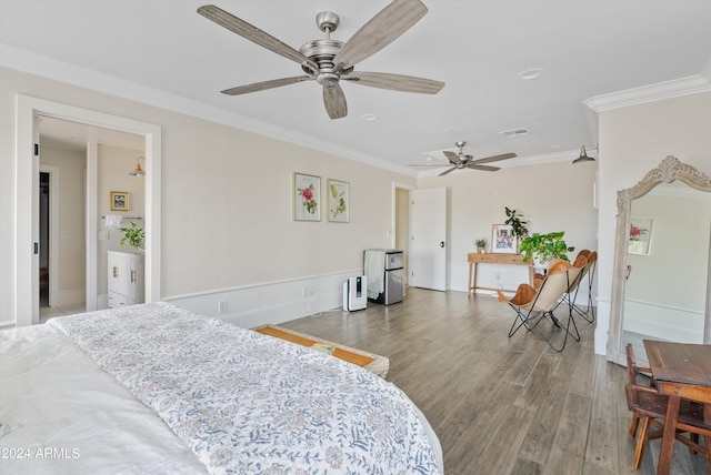 bedroom with ornamental molding, hardwood / wood-style flooring, and ceiling fan