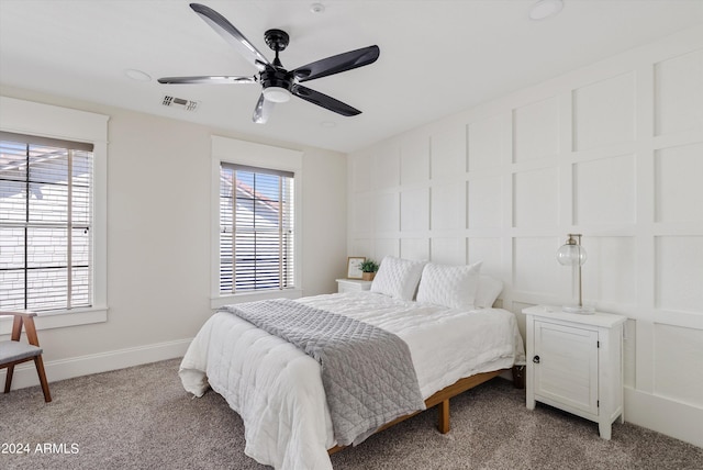 carpeted bedroom featuring ceiling fan