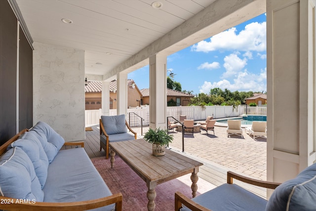 view of patio / terrace with outdoor lounge area and a fenced in pool