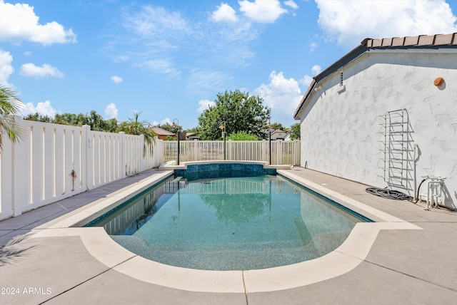 view of swimming pool featuring a patio area