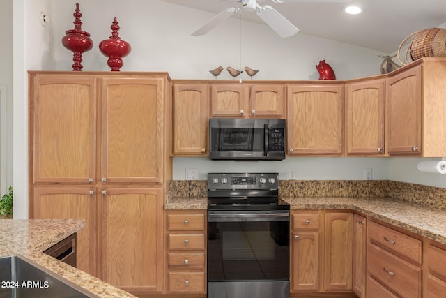 kitchen featuring ceiling fan, lofted ceiling, electric range, light brown cabinetry, and light stone countertops