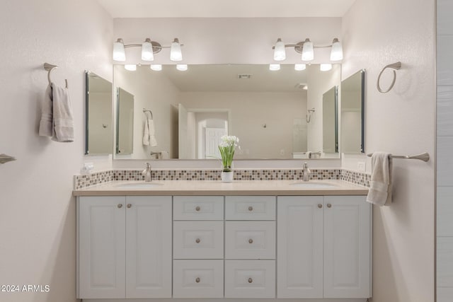 bathroom featuring decorative backsplash, walk in shower, and vanity