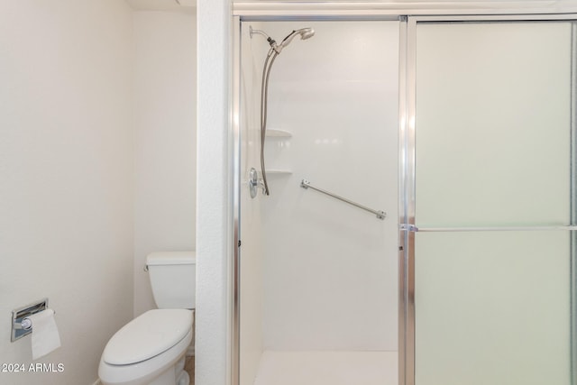 bathroom with walk in shower and toilet