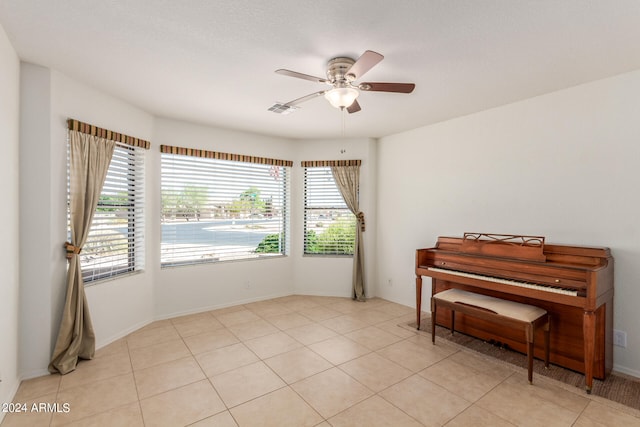 interior space featuring ceiling fan and light tile patterned floors