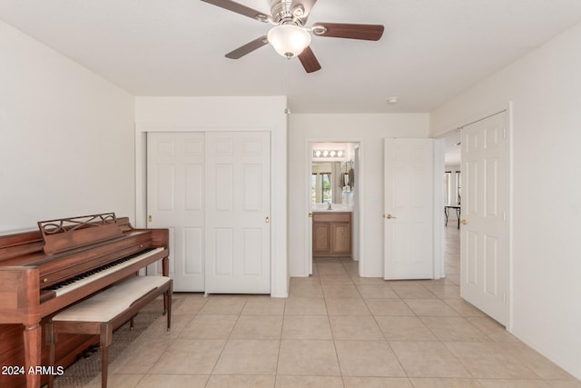 miscellaneous room featuring ceiling fan and light tile patterned flooring