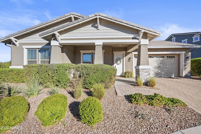 craftsman house with a garage