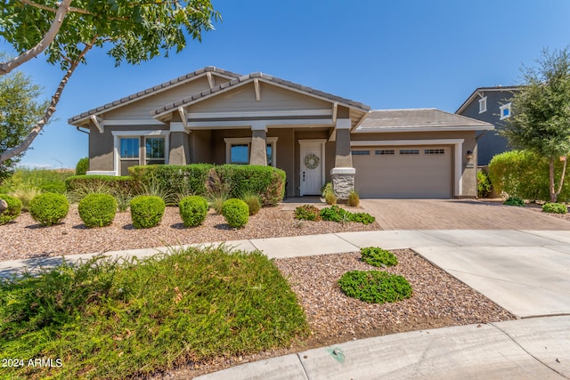 craftsman inspired home with a garage