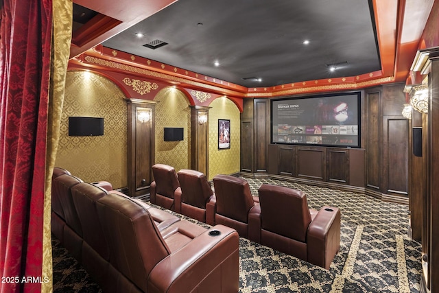 6852 E Fanfol Dr, Paradise Valley, AZ 85253 - carpeted home theater room featuring visible vents, ornate columns, a tray ceiling, and wallpapered walls