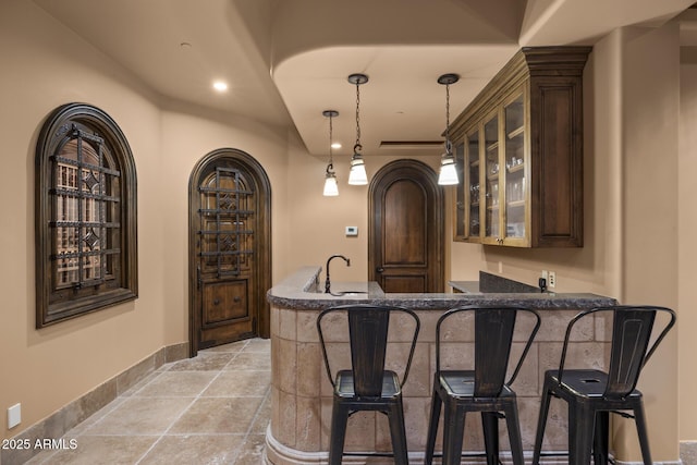 6852 E Fanfol Dr, Paradise Valley, AZ 85253 - bar with a sink, stone tile flooring, pendant lighting, wet bar, and recessed lighting