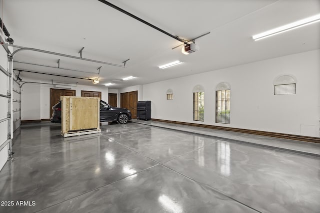6852 E Fanfol Dr, Paradise Valley, AZ 85253 - garage featuring baseboards and a garage door opener