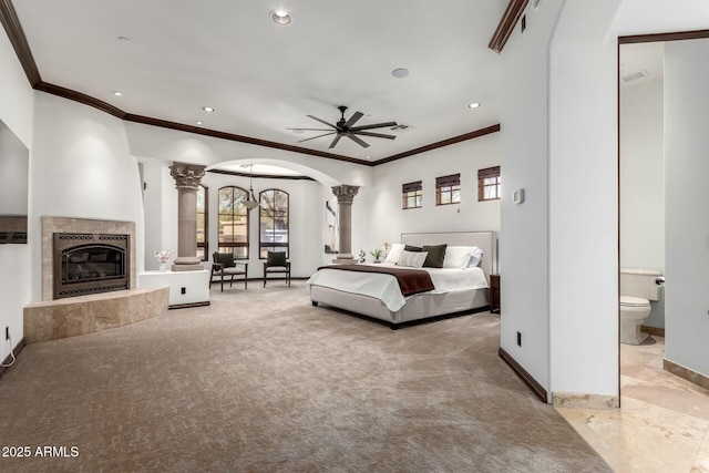 bedroom with arched walkways, a fireplace, recessed lighting, ornamental molding, and baseboards