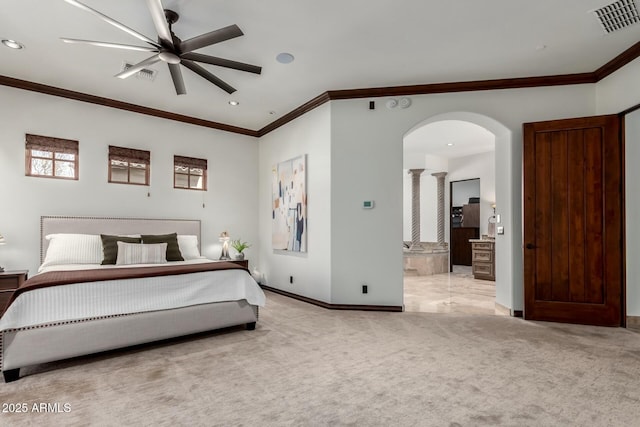 carpeted bedroom with ornamental molding, arched walkways, visible vents, and baseboards