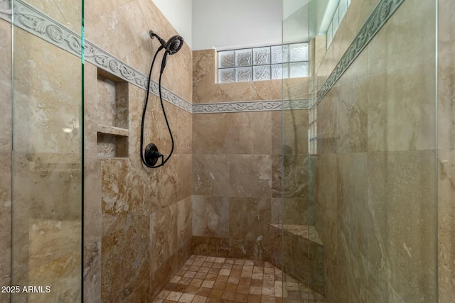 full bath featuring tiled shower