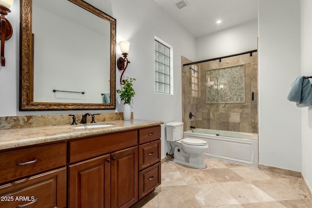 bathroom featuring baseboards, visible vents, toilet, shower / bath combination with glass door, and vanity