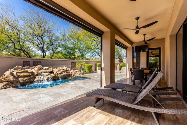 view of patio featuring ceiling fan and outdoor dining area