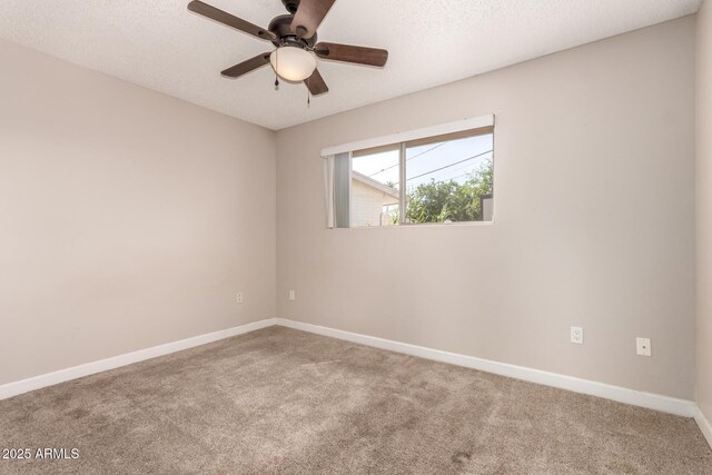 5627 E Covina Rd, Mesa, AZ 85205 - spare room with carpet flooring, ceiling fan, baseboards, and a textured ceiling