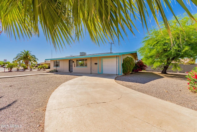 5627 E Covina Rd, Mesa, AZ 85205 - ranch-style home with concrete driveway, an attached garage, and a porch